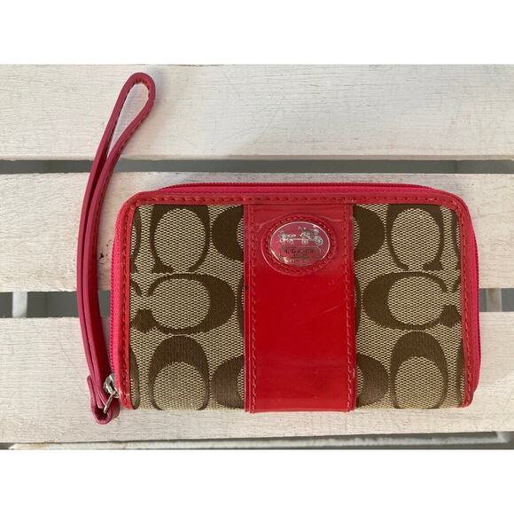 COACH SMALL TAN CANVAS SIGNATURE AND PINK LEATHER WRISTLET - Picture 1 of 9